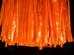 Mardi Gras Spot Orange Vinyl Fringe 15" X 10' (Pack) Petal Paper