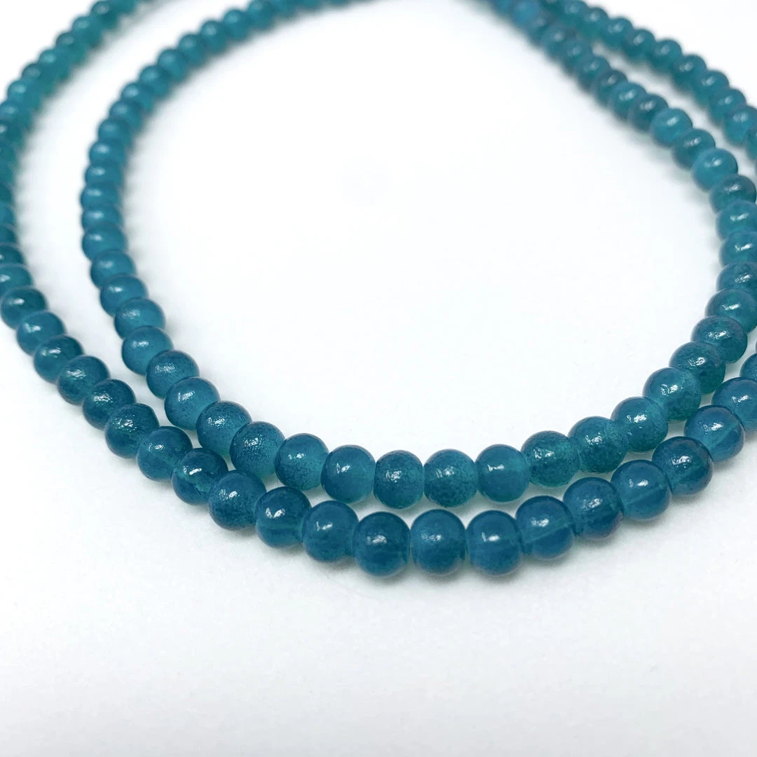 Mardi Gras Spot 27" 6mm Teal Glass Bead Necklace (Dozen) Mardi Gras Spot 27" 6mm Teal Glass Bead Necklace (Dozen)