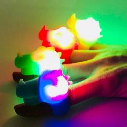 Mardi Gras Spot Light-Ups Dinosaur Ring - Assorted Colors 7 Mardi Gras Spot Light-Ups Dinosaur Ring - Assorted Colors