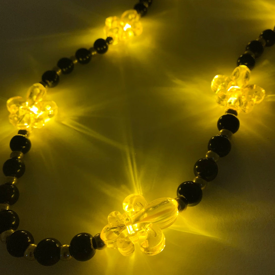 Mardi Gras Spot LED Fleur De Lis On Black And Gold Necklace Mardi Gras Spot LED Fleur De Lis On Black And Gold Necklace